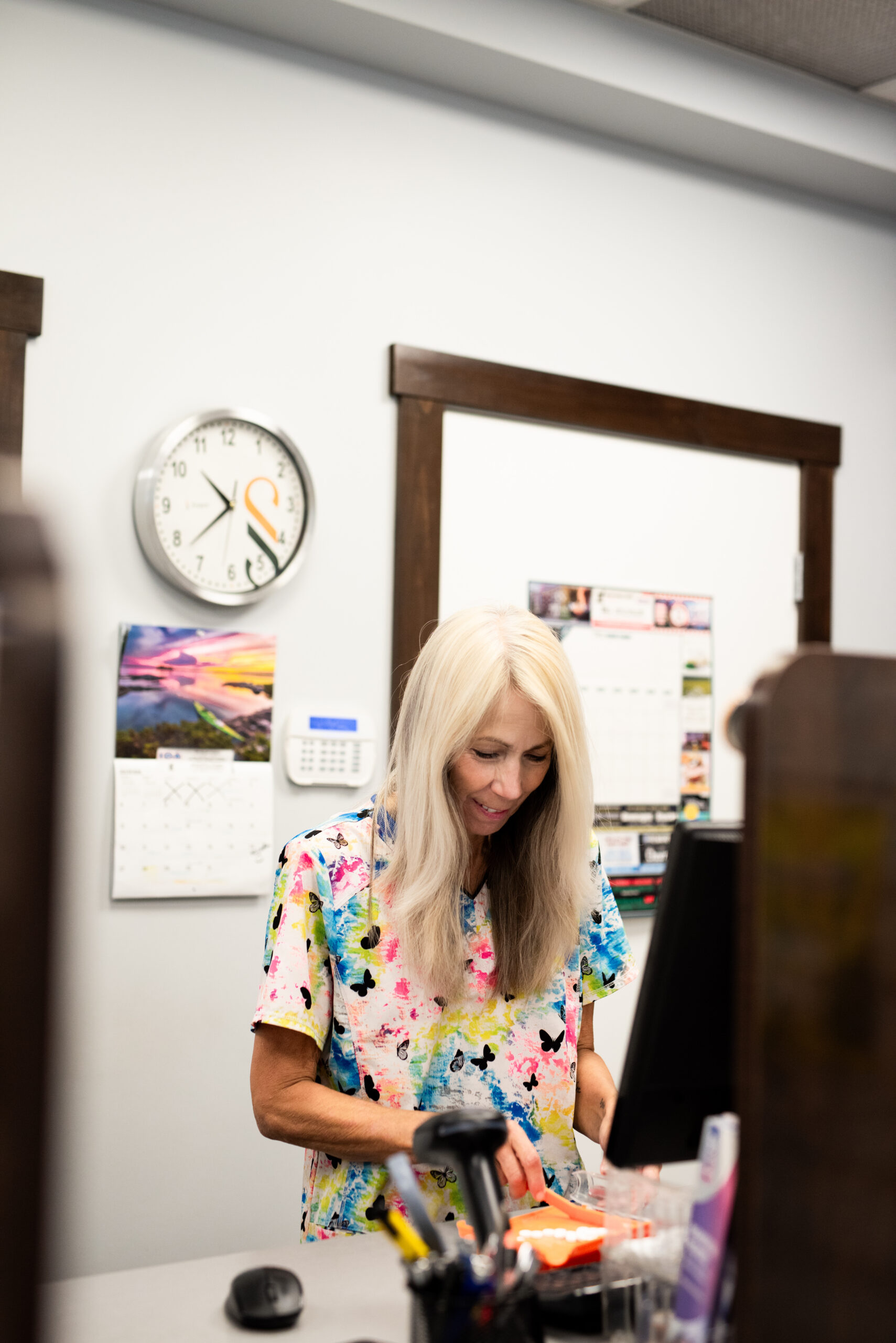 A technician helping a patient with their prescription drugs in kamloops BC.