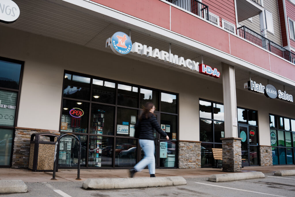 A woman walking into a Kamloops pharmacy for clinical services