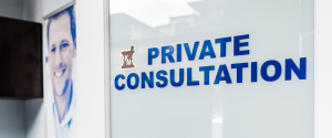 Frosted door marked Private Consultation at Kipp-Mallery Pharmacy in Kamloops.